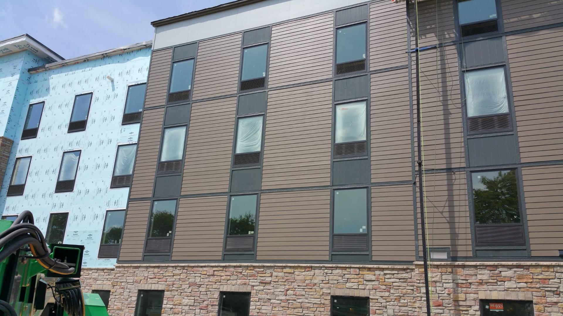 Commercial building siding and stone installation