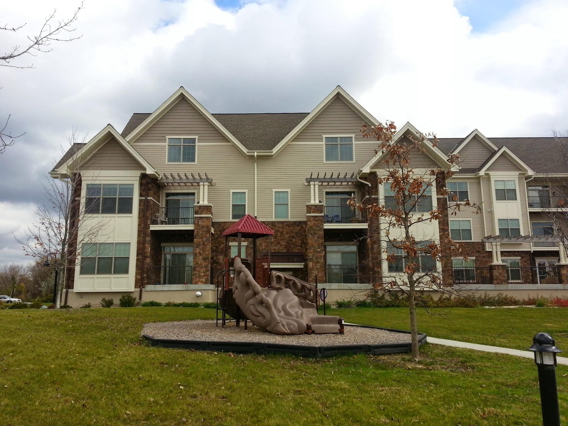 Completed multi-family apartment complex with stone and siding