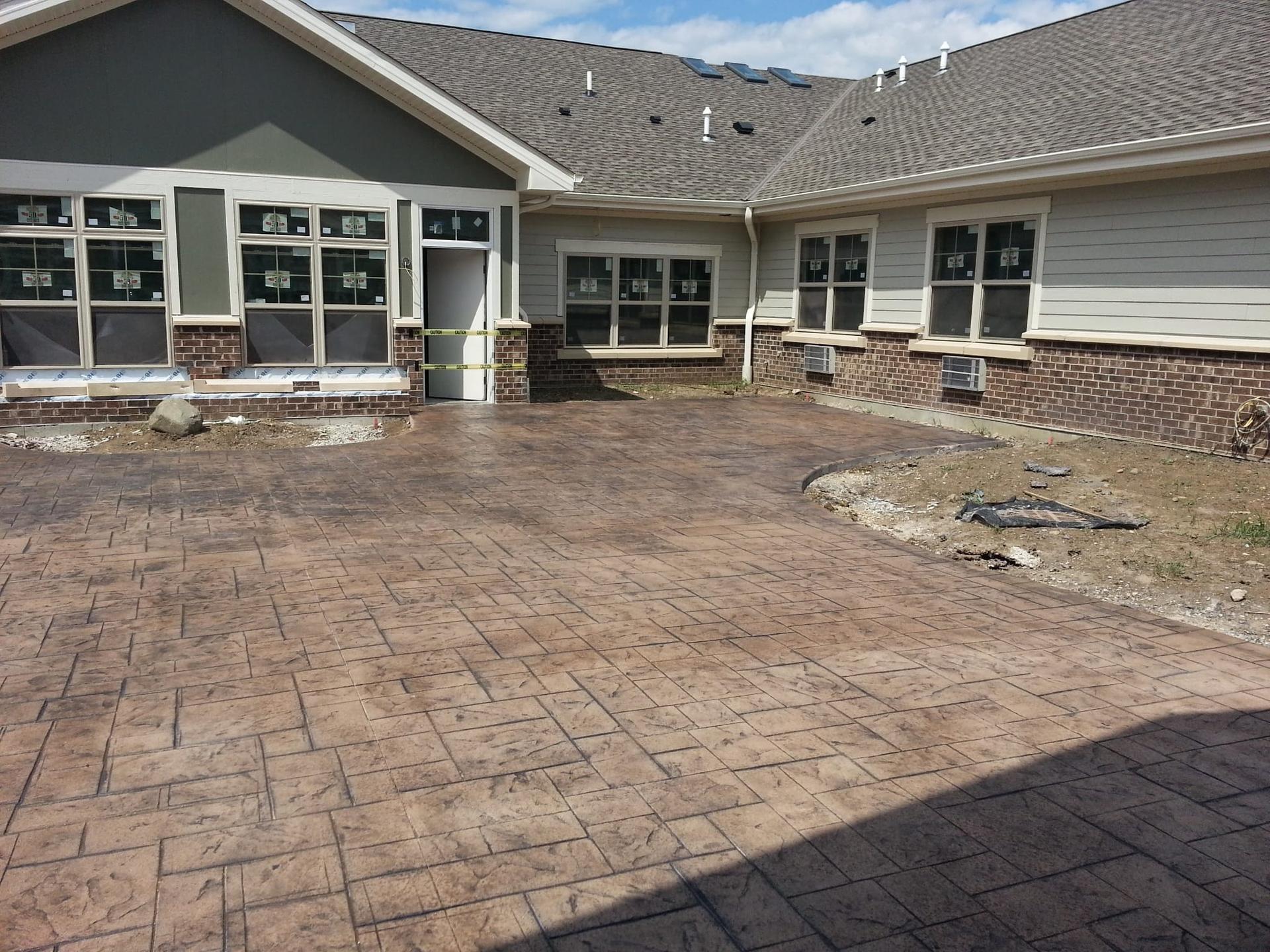 Completed residential exterior with mixed siding and brick