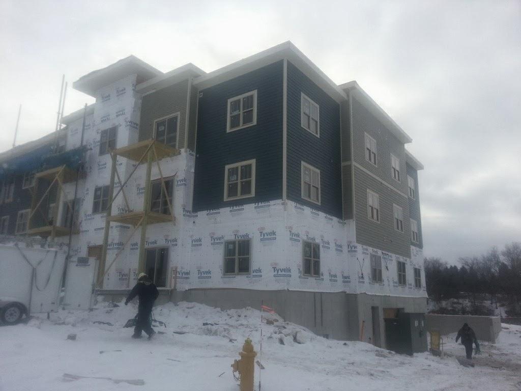 Multi-family building winter siding install