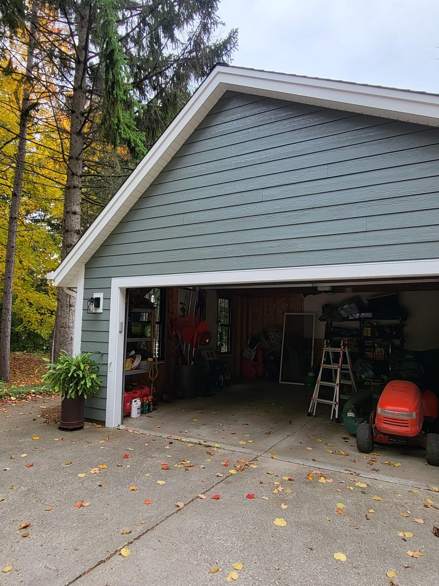 Residential home with new green siding